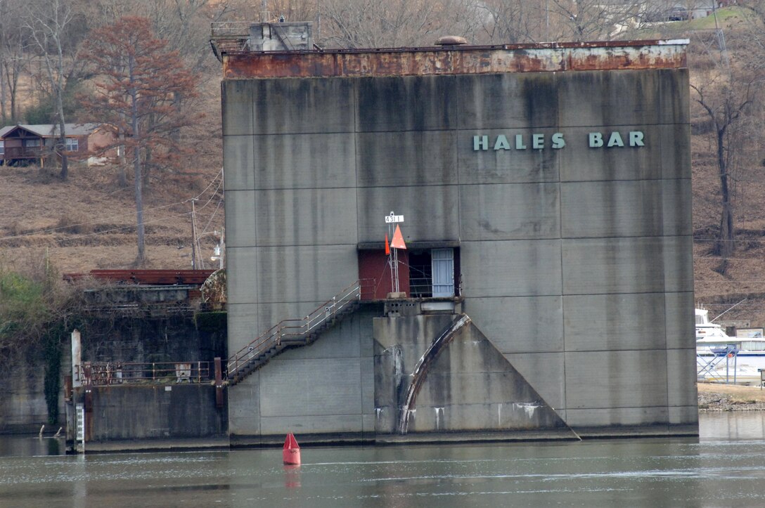 This is the Hales Bar Dam power plant building in Haletown, Tenn., taken from across the Tennessee River at the crumbling navigation lock Dec. 19, 2013 on the bank of the Tennessee River in Jasper, Tenn.  Hales Bar Dam opened in 1913 and the project was the first to provide hydropower in the world. The dam ceased operations in 1968 when Nickajack Dam opened a few miles downstream.  One hundred years later the region looks back and remembers life at Hales Bar Dam and Navigation Lock.