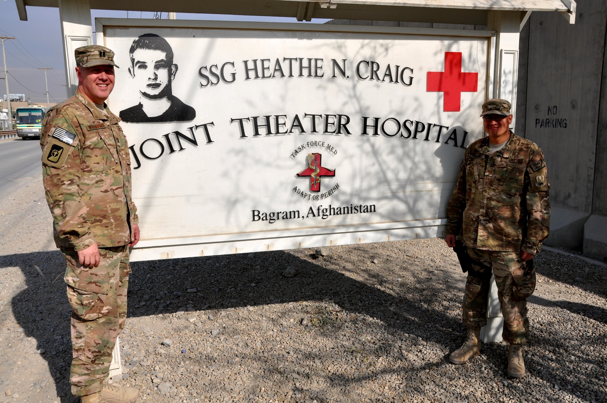 Chaplain (Capt.) Gary Willeford and Chaplain Assistant Tech. Sgt. Brian Ramirez pose for a photograph in front of Craig Joint Theater Hospital, Bagram Airfield, Afghanistan. Willeford and Ramirez are one of two religious support teams providing religious support and counsel to patients and caregivers at Craig Joint Theater Hospital. (Courtesy photo) 