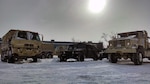 Soldiers of the 1166th Transportation Company from Worcester prepare their LMTVs for tide and flood checks here as part of the Guard’s response to the New Year’s Winter Storm Hercules, Jan. 3, 2014.