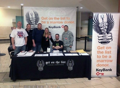 Army Master Sgt. Frankie Gomez, far right, represents Salute to Life, the Department of Defense's bone marrow registry program, at a joint civilian-military bone marrow donor drive during Hope Strength at the Colorado Avalanche game Nov. 8, 2013, in Denver.