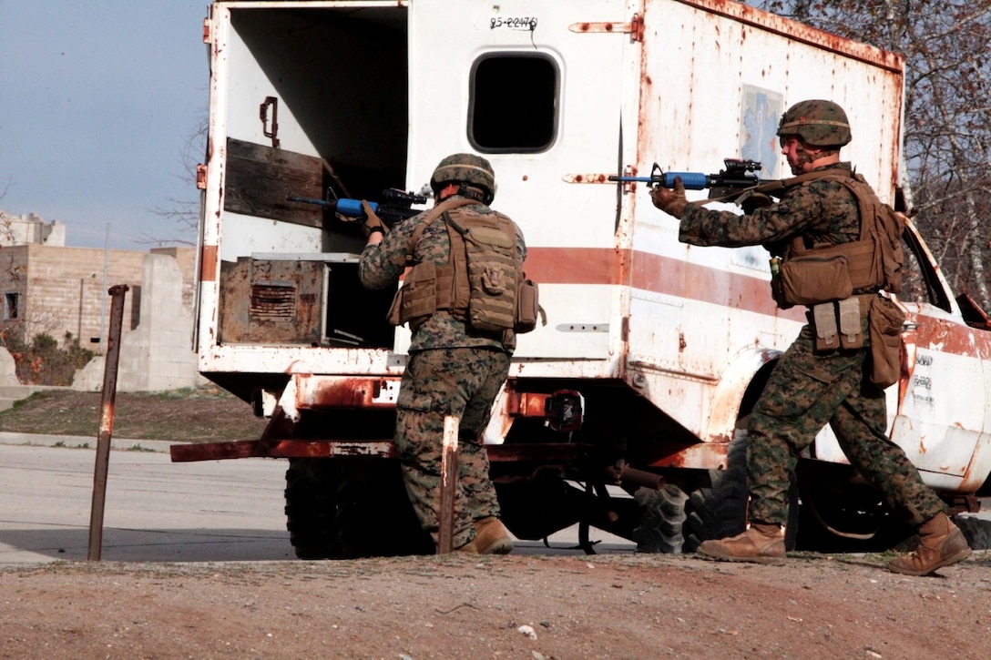 Marines with 2nd Battalion, 1st Marines rush across a street to establish security aboard Camp Pendleton, Calif., Jan. 7. The Marines participated in Special Operations Training Group’s exercises to increase combat effectiveness before a deployment.