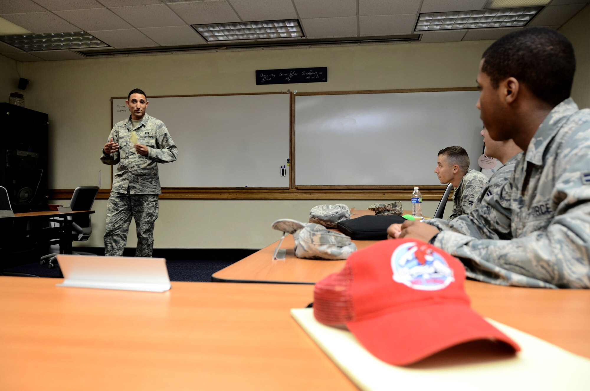 Airman 1st Class Imran Farooqi, 554th RED HORSE Squadron pavement and equipment apprentice, speaks in front of fellow Airmen while attending a class at the first term Airmen center Jan. 9, 2013 on Andersen Air Force Base, Guam. FTAC is a program that facilitates representatives from different base units who help Airmen get started on their careers and to learn the tools necessary to become successful. (U.S. Air Force photo by Airman 1st Class Amanda Morris/Released)