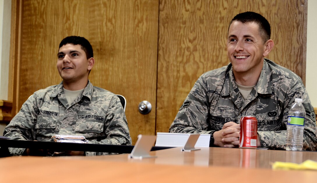 Airmen are engaged in a presentation while attending a class at the first term Airmen center Jan. 9, 2014, on Andersen Air Force Base, Guam. During the week-long course, Airmen are briefed about topics including financial management, resiliency, safety, educational benefits and volunteer opportunities. (U.S. Air Force photo by Airman 1st Class Amanda Morris/Released)