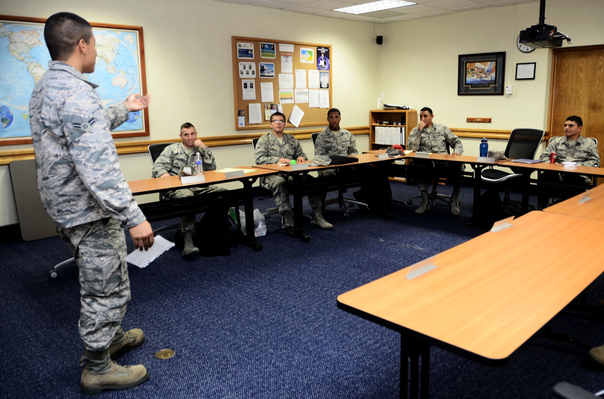 Airman 1st Class Enrique Flores, 36th Civil Engineer Squadron electrical systems apprentice, practices his speaking skills while attending a class at the first term Airmen center Jan. 9, 2014, on Andersen Air Force Base, Guam. FTAC is a program that facilitates representatives from different base units who help Airmen get started on their careers and to learn the tools necessary to become successful. (U.S. Air Force photo by Airman 1st Class Amanda Morris/Released)