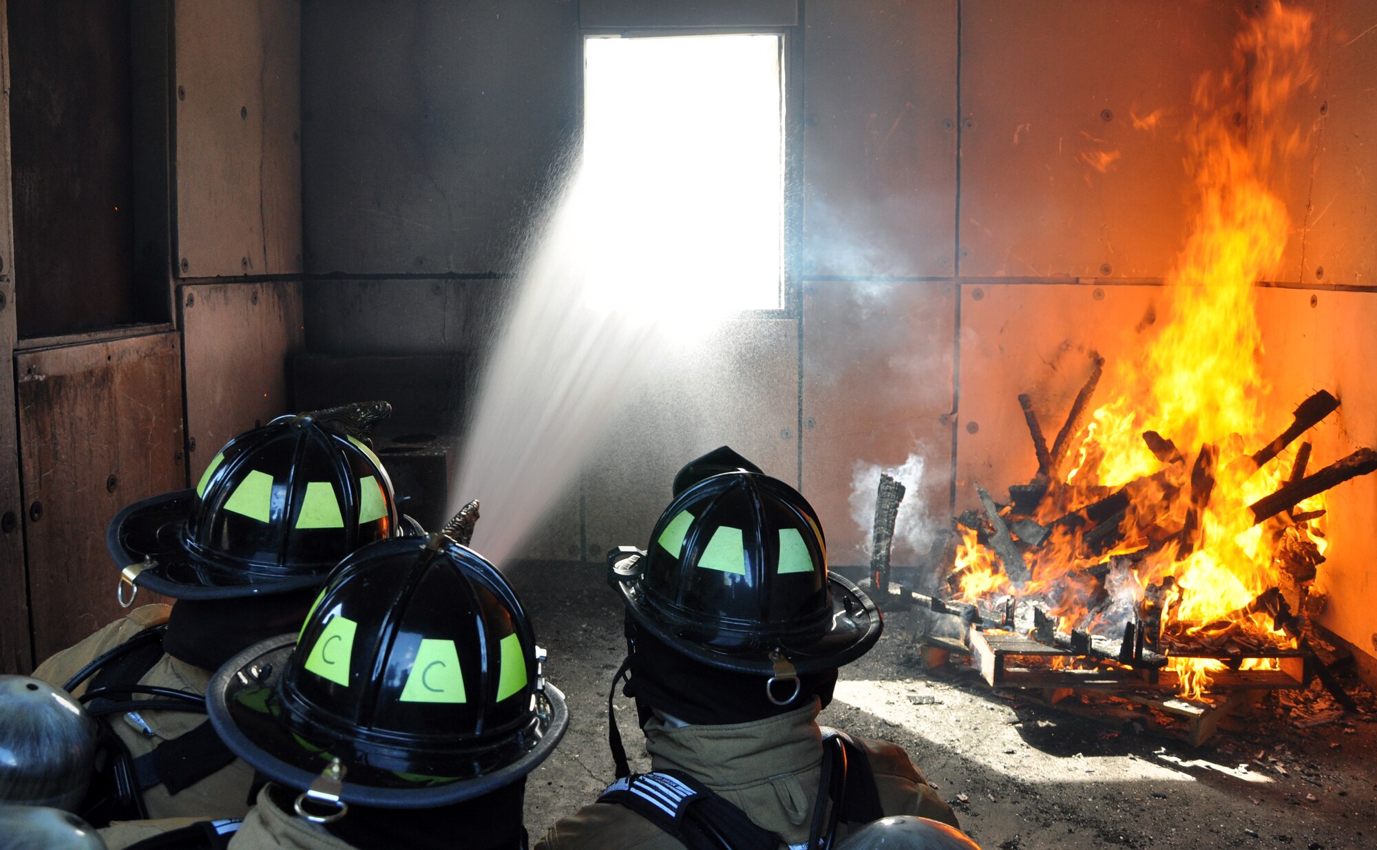 U.S. Air Force Brig. Gen. Peter E. Gersten, Deputy Director for Politico-Military Affairs (Western Hemisphere), Strategic Plans and Policy Directorate, Joint Staff, the Pentagon, Washington, D.C., got an up close and personal look at the job of the firefighters from Joint Task Force-Bravo's 612th Air Base Squadron at Soto Cano Air Base, Honduras, Jan. 13, 2014. Gersten donned fire protective gear and joined the firefighters during a live-burn training exercise in the Soto Cano Air Base "burn house," during which the firefighters were able to demonstrate for the General the tactics used to combat fires.  (U.S. Air Force photo by Capt. Zach Anderson)
