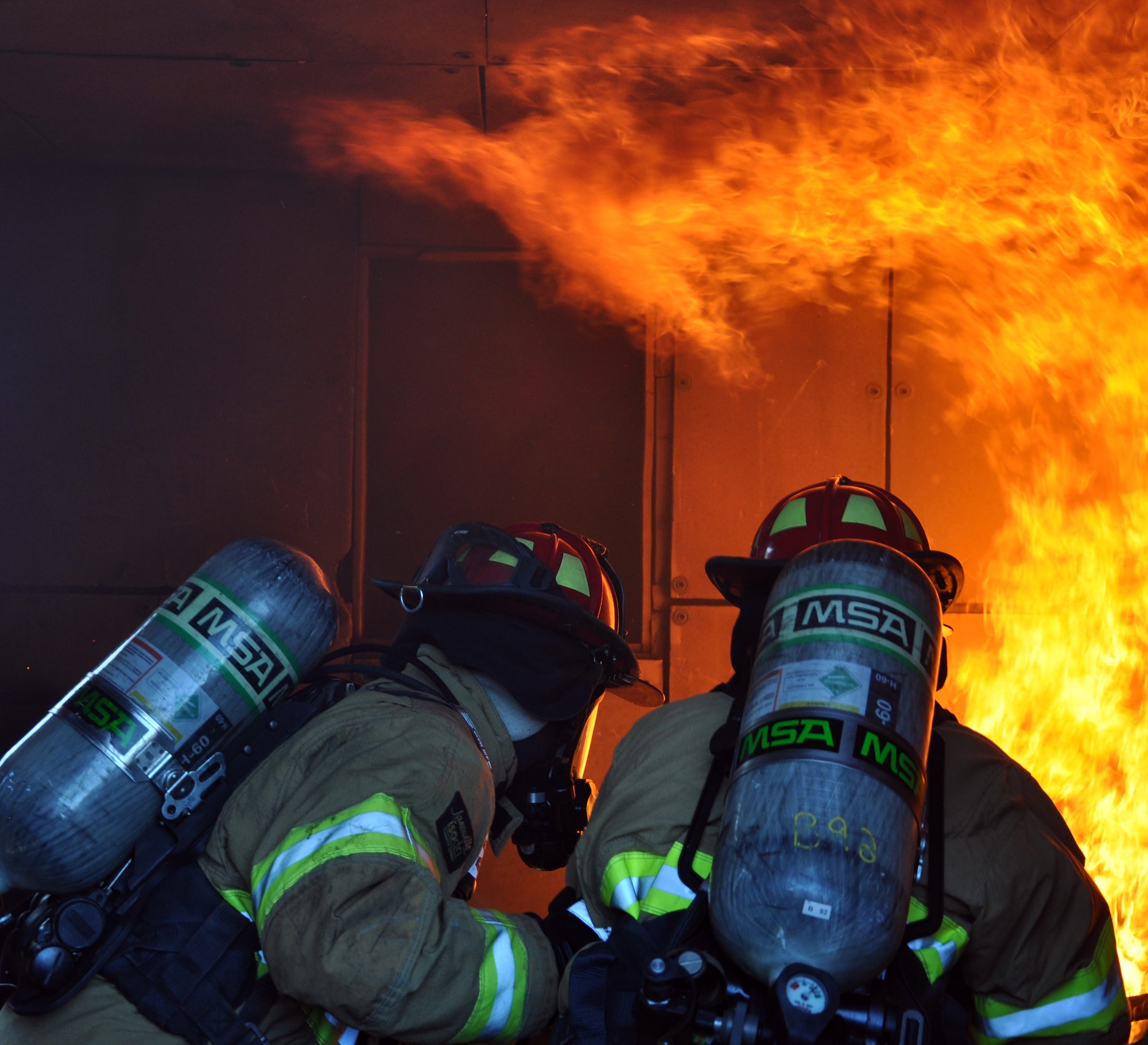 U.S. Air Force Brig. Gen. Peter E. Gersten, Deputy Director for Politico-Military Affairs (Western Hemisphere), Strategic Plans and Policy Directorate, Joint Staff, the Pentagon, Washington, D.C., got an up close and personal look at the job of the firefighters from Joint Task Force-Bravo's 612th Air Base Squadron at Soto Cano Air Base, Honduras, Jan. 13, 2014. Gersten donned fire protective gear and joined the firefighters during a live-burn training exercise in the Soto Cano Air Base "burn house," during which the firefighters were able to demonstrate for the General the tactics used to combat fires.  (U.S. Air Force photo by Capt. Zach Anderson)