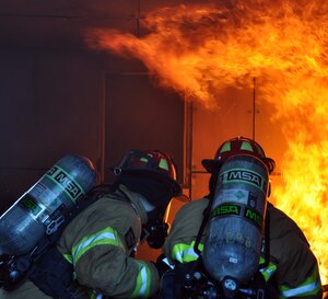 U.S. Air Force Brig. Gen. Peter E. Gersten, Deputy Director for Politico-Military Affairs (Western Hemisphere), Strategic Plans and Policy Directorate, Joint Staff, the Pentagon, Washington, D.C., got an up close and personal look at the job of the firefighters from Joint Task Force-Bravo's 612th Air Base Squadron at Soto Cano Air Base, Honduras, Jan. 13, 2014. Gersten donned fire protective gear and joined the firefighters during a live-burn training exercise in the Soto Cano Air Base "burn house," during which the firefighters were able to demonstrate for the General the tactics used to combat fires.  (U.S. Air Force photo by Capt. Zach Anderson)
