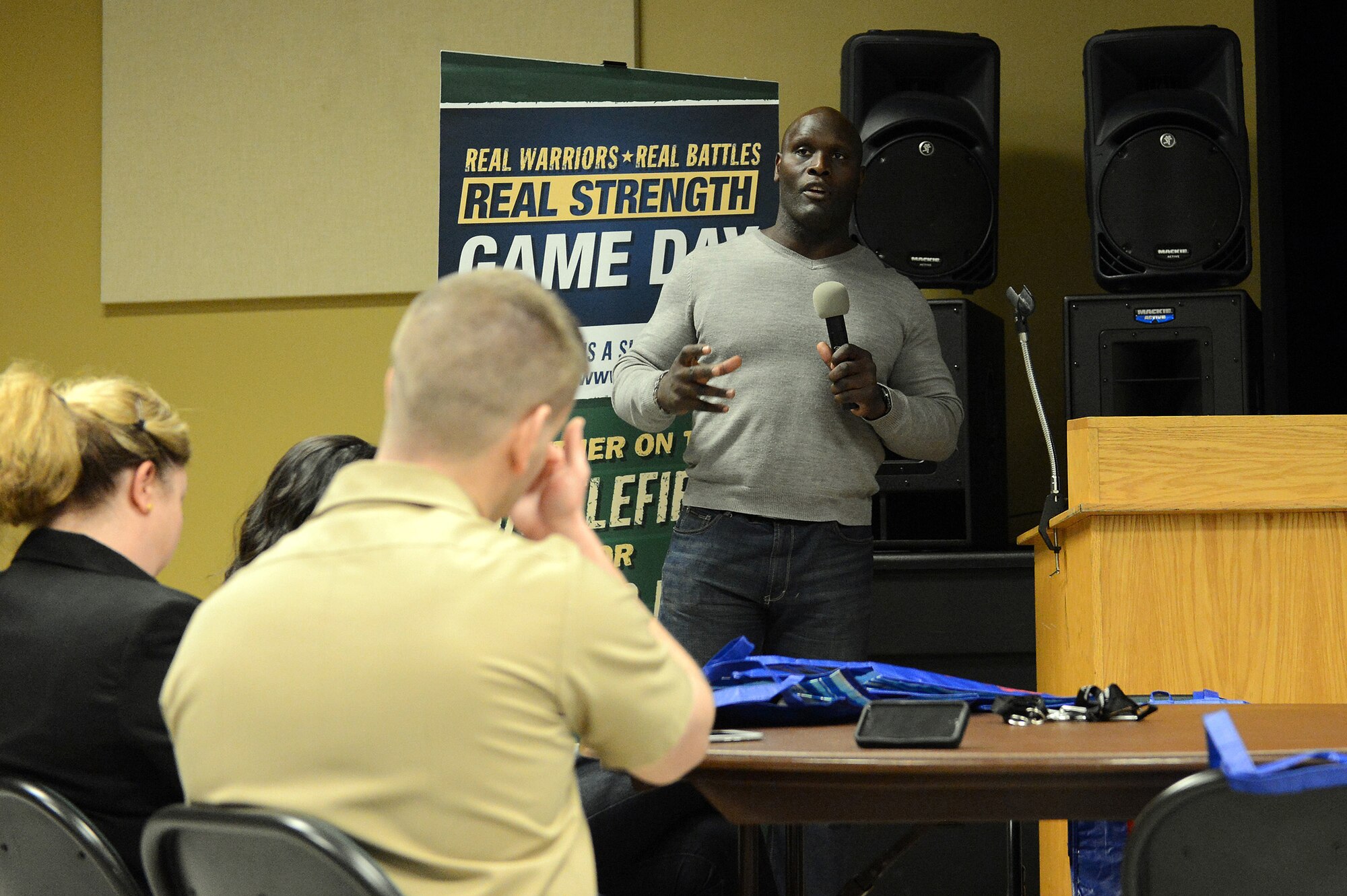 Ricardo McDonald, former National Football League linebacker, speaks to service members about the struggles he faced transitioning from the NFL to a civilian job, Jan. 12, 2014 at Joint Base Lewis-McChord Wash. Former NFL players with the Real Warriors Campaign discussed reintegration challenges facing service members and available resources available to help overcome the challenges, during the Defense Centers of Excellence Game Day Event held at the Nelson Recreation Center at JBLM. (U.S. Air Force photo/Airman 1st Class Jacob Jimenez)  