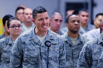 First Lt. Klinton Holscher, 90th Medical Support Squadron, asks U.S. Defense Secretary Chuck Hagel a question during an Airman event at the 90th Maintenance Group high bay on F.E. Warren Air Force Base, Wyo., Jan. 9, 2014. . Hagel visited Warren AFB and the 90th Missile Wing to learn about the ICBM mission and the people who operate, maintain, secure and support the Minuteman III weapon system. (U.S. Air Force photo by R.J. Oriez) 