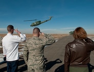 Members of the 319th Missile Squadron salute as U.S. Defense Secretary Chuck Hagel departs Missile Alert Facility E-01 in Kimball County, Neb., Jan. 9, 2014, on a UH-1N "Huey" from the 37th Helicopter Squadron. Hagel visited F.E. Warren Air Force Base, Wyo., and the 90th MW to learn about the ICBM mission and the people who operate, maintain, secure and support the Minuteman III weapon system. (U.S. Air Force photo by R.J. Oriez)