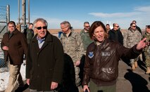 Lt. Col. Cathy Barrington, 319th Missile Squadron commander, shows U.S. Defense Secretary Chuck Hagel the above-ground support facilities upon his arrival by helicopter to the E-01 Missile Alert Facility in Kimball County, Neb., Jan 9, 2014. Hagel visited F.E. Warren Air Force Base and the 90th Missile Wing to learn about the ICBM mission and the people who operate, maintain, secure and support the Minuteman III weapon system. (U.S. Air Force photo by R.J. Oriez) 