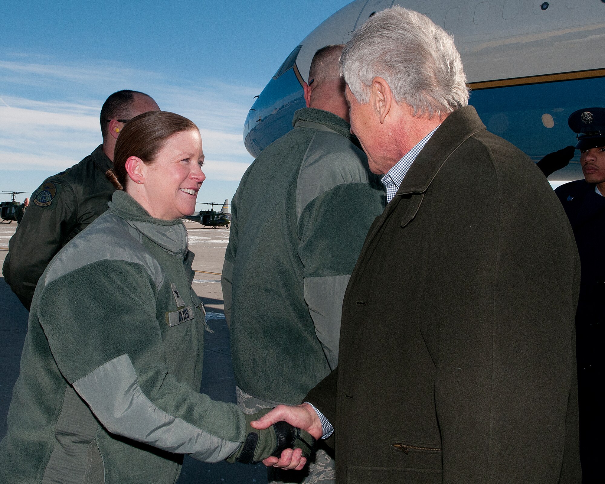 U.S. Defense Secretary Chuck Hagel is greeted by Col. Tracey Hayes, 90th Missile Wing commander, as he arrives in Cheyenne, Wyo., Jan. 9, 2014. Hagel visited F.E. Warren Air Force Base and the 90th MW to learn about the ICBM mission and the people who operate, maintain, secure and support the Minuteman III weapon system. (U.S. Air Force photo by R.J. Oriez)
