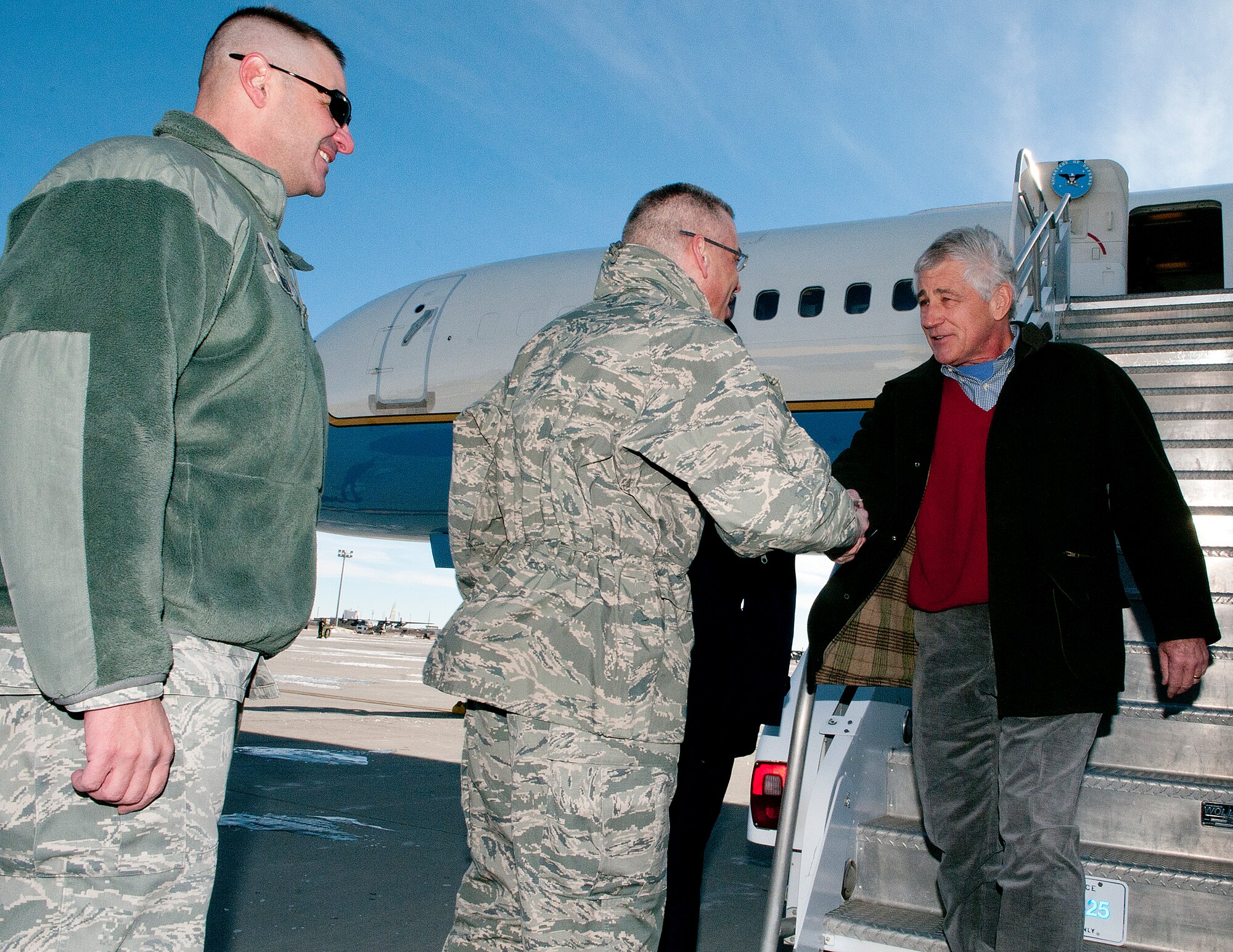U.S. Defense Secretary Chuck Hagel is greeted by Maj. Gen. Jack Weinstein, 20th Air Force commander, as he arrives in Cheyenne, Wyo., Jan. 9, 2014, as Chief Master Sgt. David Nordel, 20th AF command chief, looks on. Hagel visited F.E. Warren AFB and the 90th Missile Wing to learn about the ICBM mission and the people who operate, maintain, secure and support the Minuteman III weapon system. (U.S. Air Force photo by R.J. Oriez)