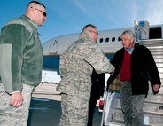 U.S. Defense Secretary Chuck Hagel is greeted by Maj. Gen. Jack Weinstein, 20th Air Force commander, as he arrives in Cheyenne, Wyo., Jan. 9, 2014, as Chief Master Sgt. David Nordel, 20th AF command chief, looks on. Hagel visited F.E. Warren AFB and the 90th Missile Wing to learn about the ICBM mission and the people who operate, maintain, secure and support the Minuteman III weapon system. (U.S. Air Force photo by R.J. Oriez)