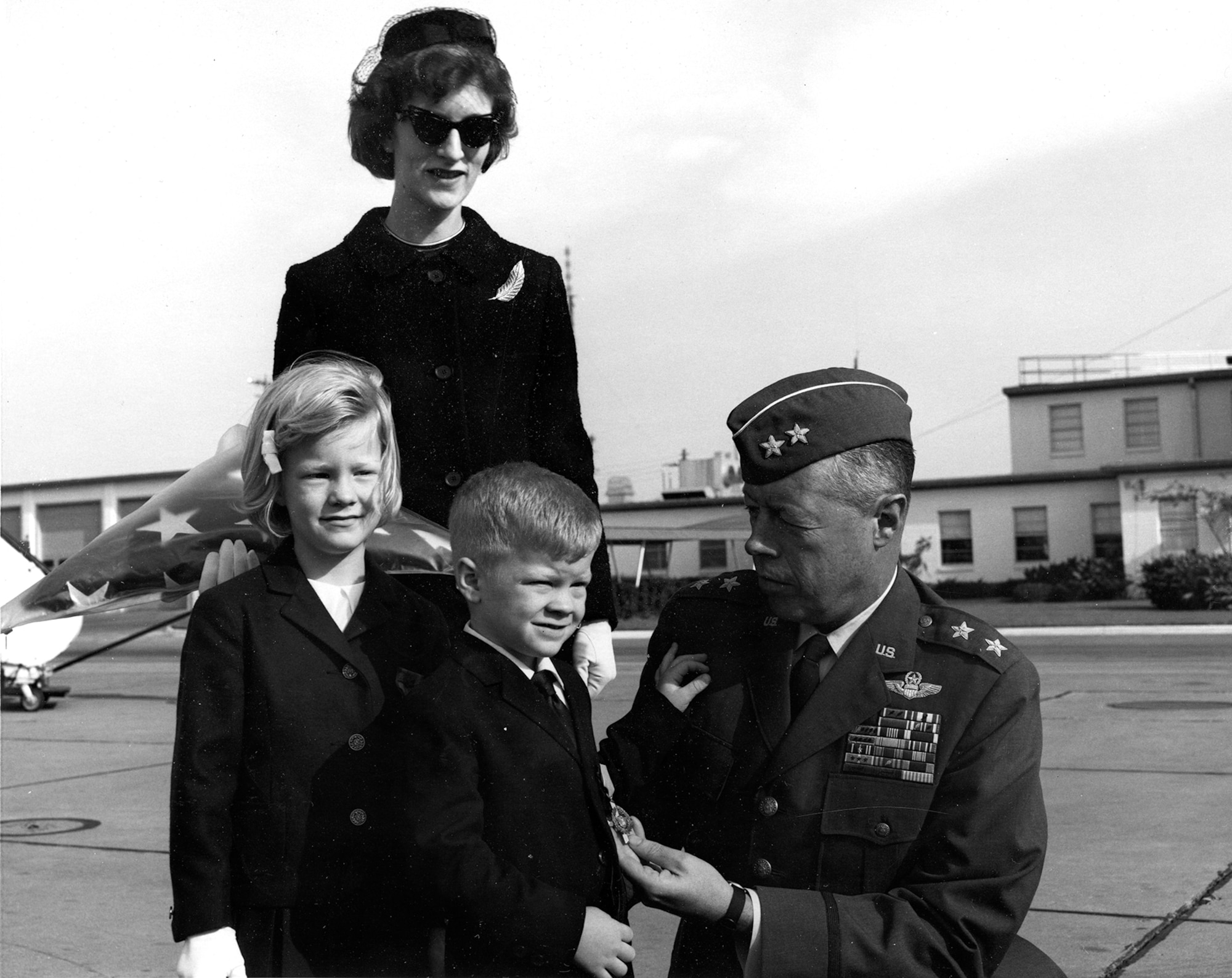 In November 1965 Maj. Gen. John Meyer presented the Air Force Cross on display to Capt. Jack Weatherby's widow, Barbara Weatherby, son Richard and daughter D’Ann. (U.S. Air Force photo)