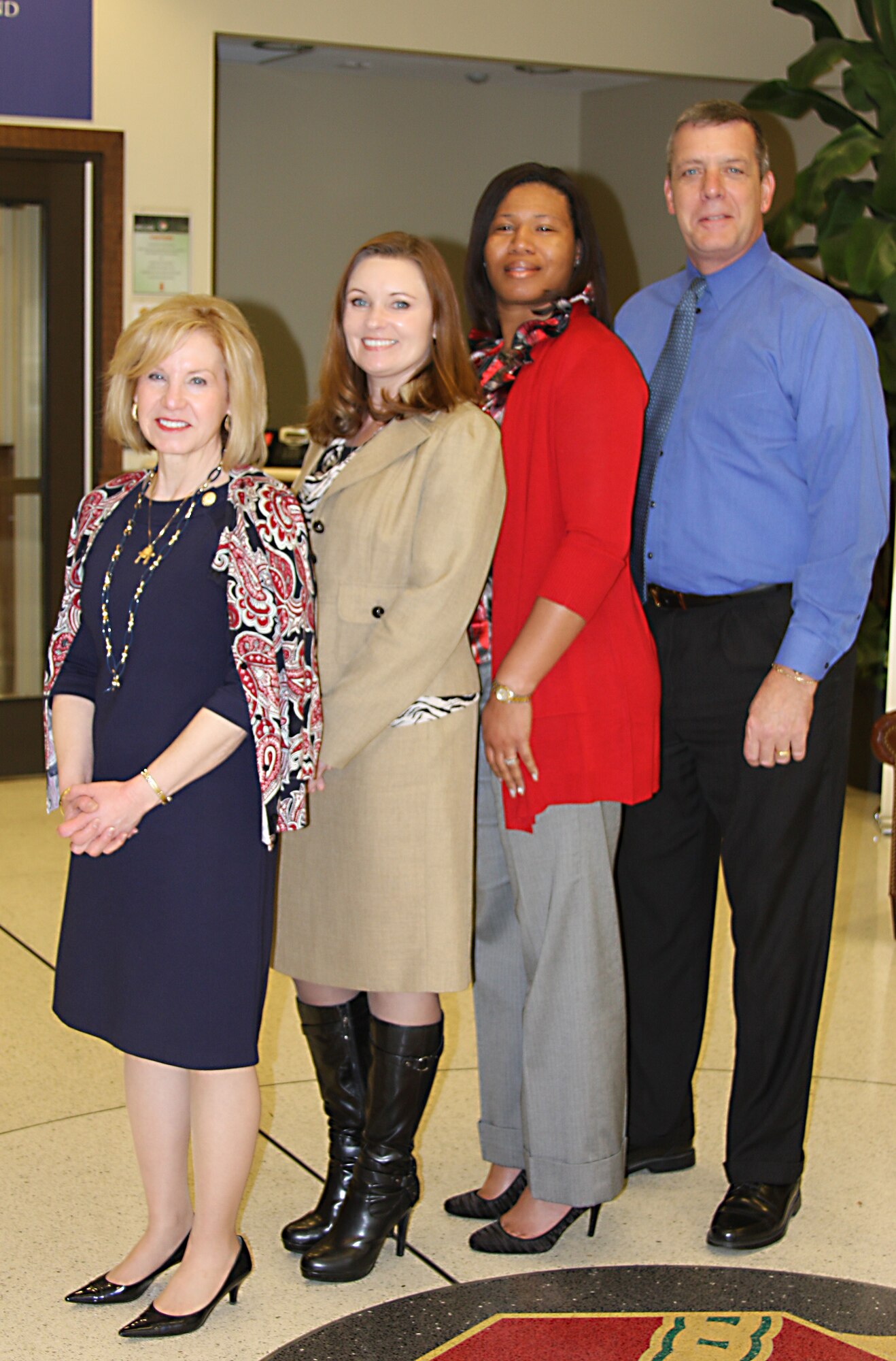 The U.S. Army Installation Management Command headquarters customer service excellence team - from right, Karen Adams, Vonda Bell, Alishia Jones and Russell Matthias.  Analyzing customer comments from the Interactive Customer Evaluation system, gives IMCOM a report card of its programs, facilities and quality of customer service. (U.S. Army photo by Amanda Kraus Rodriguez/Released)