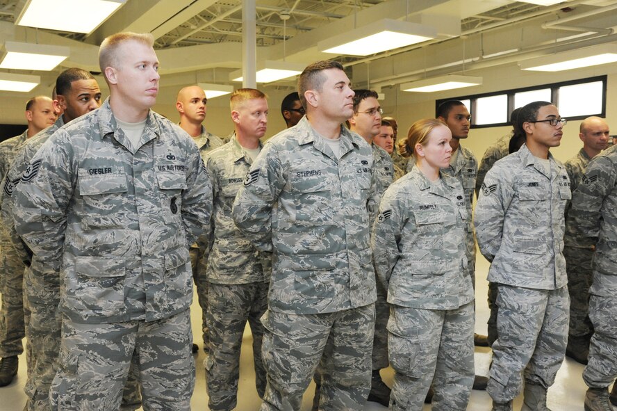 Members of the 927th Security Forces Squadron listen during an award presentation  Jan. 11, 2014 at MacDill Air Force Base, Fla.  As Air Force Reservists, the members of 927th SFS serve not only MacDill Air Force base, but various civilian law enforcement agencies throughout the country as well.  (U.S. Air Force photo by Staff Sgt. Jennie Chamberlin)
