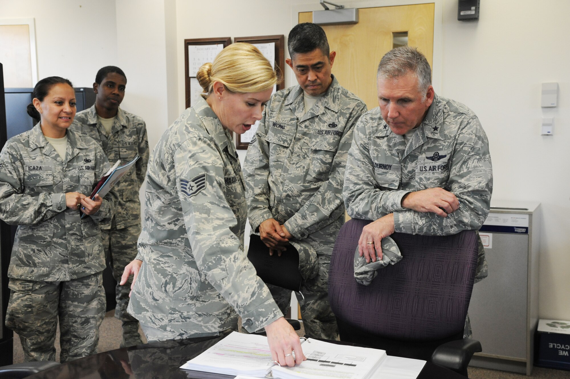 Staff Sgt. Priscilla Marshall, 927th Logistics Readiness Squadron, briefs Brig. Gen. John Flournoy, 4th Air Force commander, and Chief Master Sgt. Brian Wong, 4th Air Force command chief master sergeant, on the duties of the 927th LRS Plans and Integration Office at MacDill Air Force Base, Fla., Jan. 14, 2014.  General Flournoy and Chief Wong toured the units of the 927th Air Refueling Wing, meeting with Airmen and learning about their units and missions.  (U.S. Air Force photo by Staff Sgt. Jennie Chamberlin)