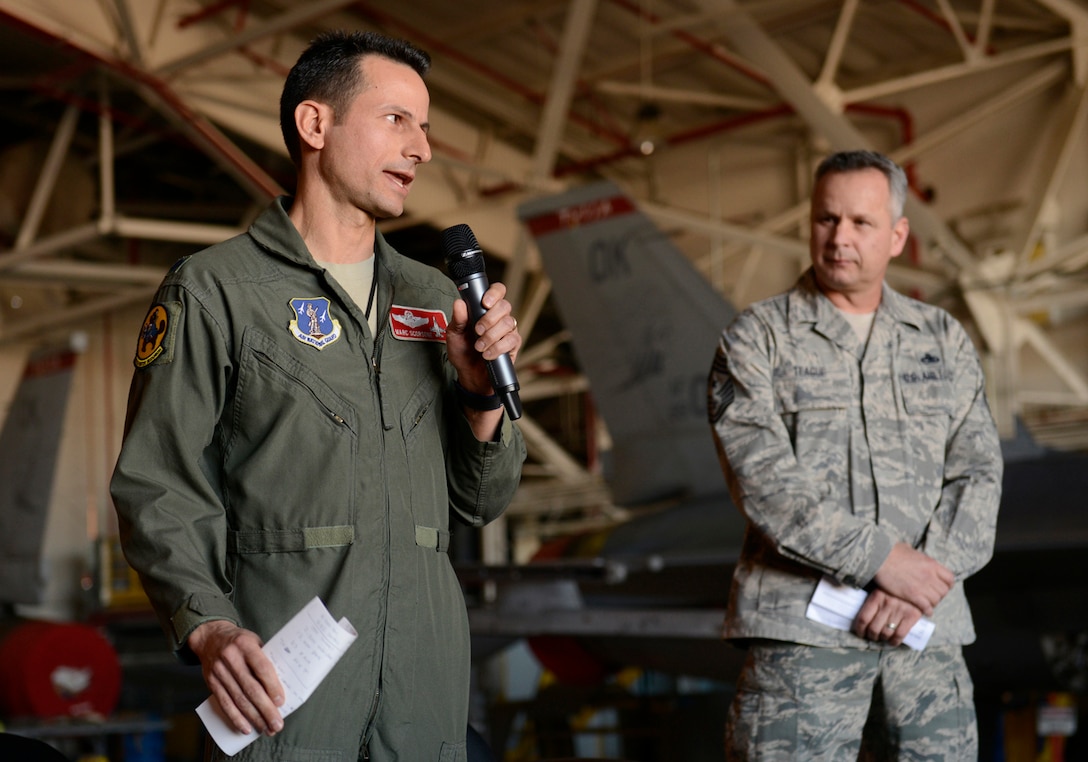 Lieutenant Colonel Marc Scorsone, 125th Fighter Squadron Commander, addresses members of the 138th Fighter Wing during January 2014 Commander's Call.  Lt Col Scorsone was the Expeditionary Fighter Squadron Commander on a recent AEF deployment to Afghanistan.  (U.S. National Guard photo by:  Master Sergeant Mark A. Moore/Released)