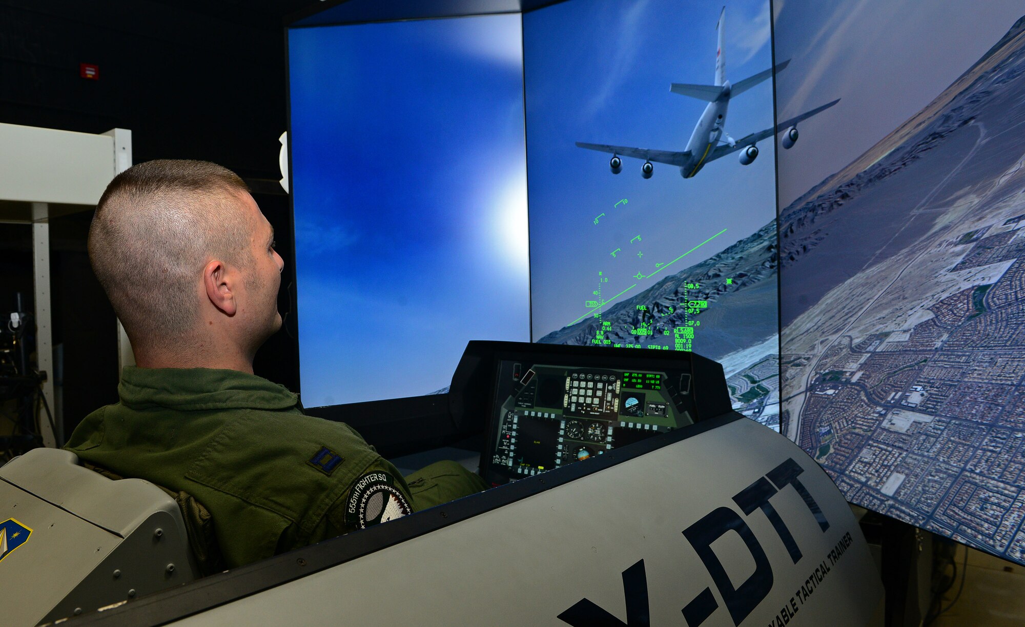 Capt. Matthew Sabraw, 555th Fighter Squadron pilot, operates a simulated flight during training, Dec. 12, 2013, at Aviano Air Base, Italy. ”Triple Nickel” pilots adhere to a strict training program tailored to Aviano’s mission that includes simulator training, staying current on qualifications and reviewing several academic materials. (U.S. Air Force photo/Senior Airman Matthew Lotz)