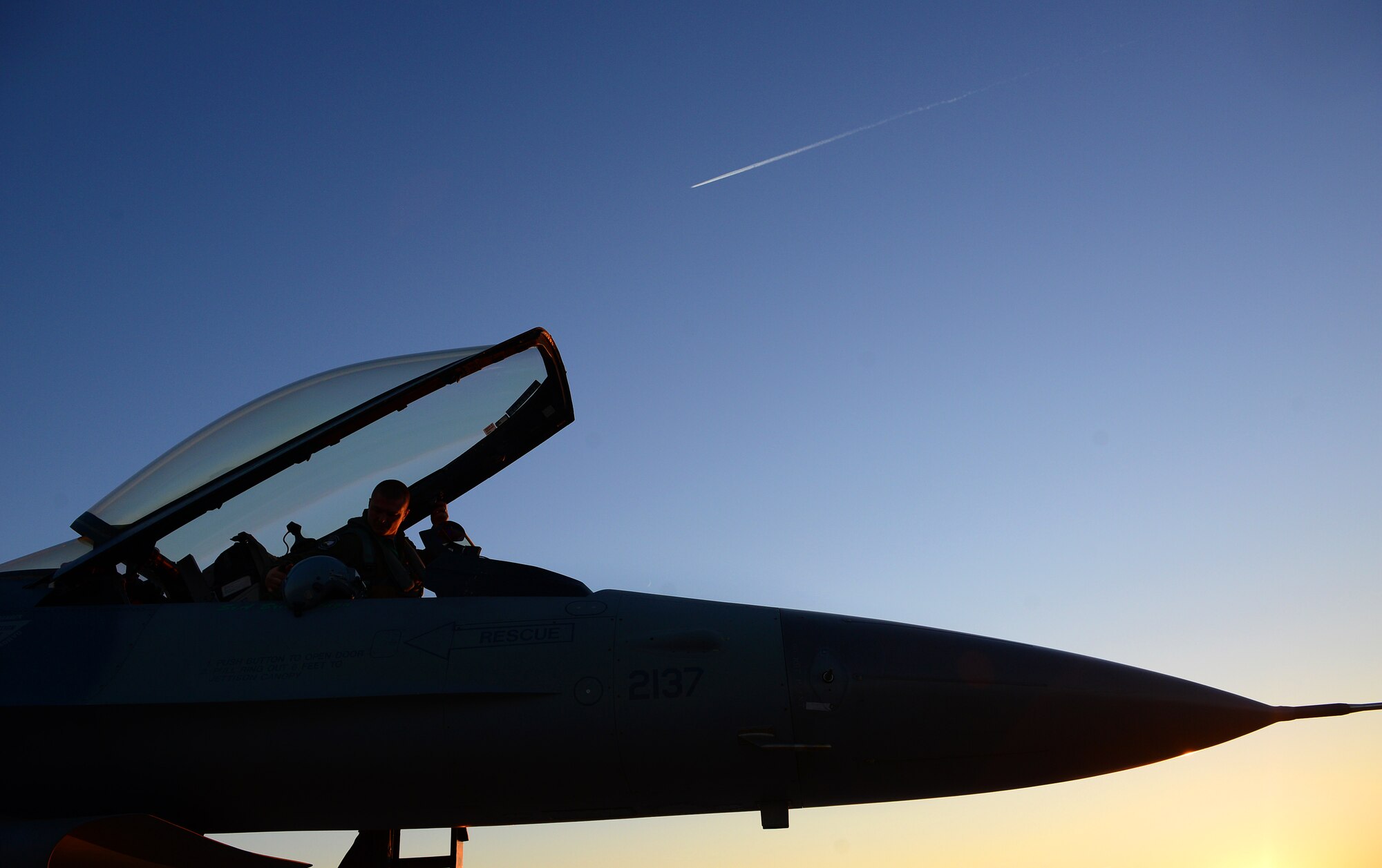 Capt. Matthew Sabraw, 555th Fighter Squadron pilot, finishes last minute checks before closing the F-16 Fighting Falcon’s canopy, Dec. 5, 2013, at Aviano Air Base, Italy. The F-16 can reach speeds as fast as Mach 2, otherwise known as 1,500 mph at altitude. (U.S. Air Force photo/Senior Airman Matthew Lotz)