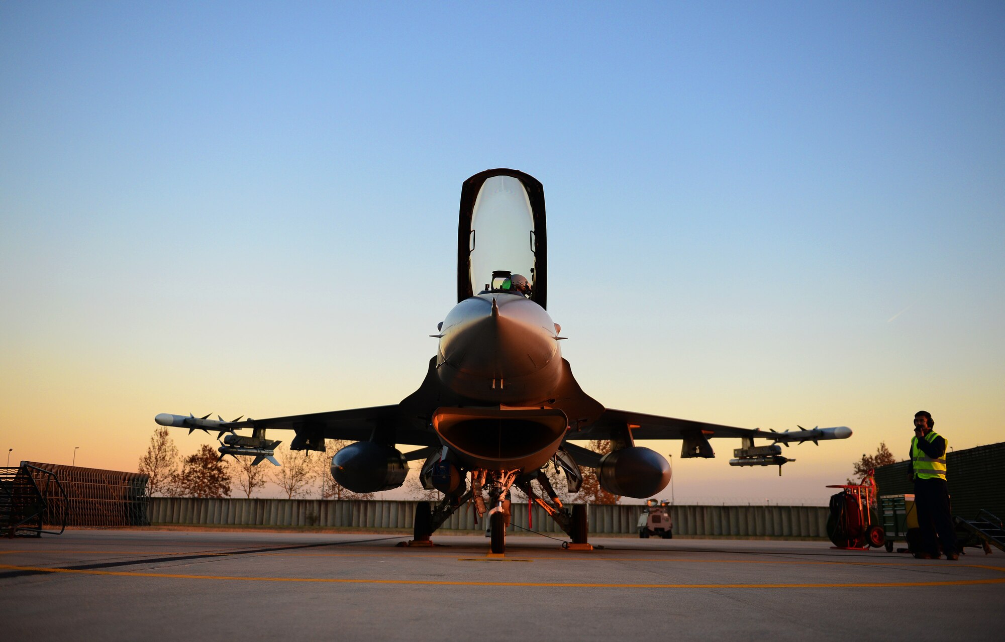 Capt. Matthew Sabraw, 555th Fighter Squadron pilot, finishes last minute checks before closing the F-16 Fighting Falcon’s canopy, Dec. 5, 2013, at Aviano Air Base, Italy. The 555th Fighter Squadron, also known as the “Triple Nickel,” provides air combat power for the 31st Fighter Wing as well as NATO counterparts in order to meet national security objectives. (U.S. Air Force photo/Senior Airman Matthew Lotz)