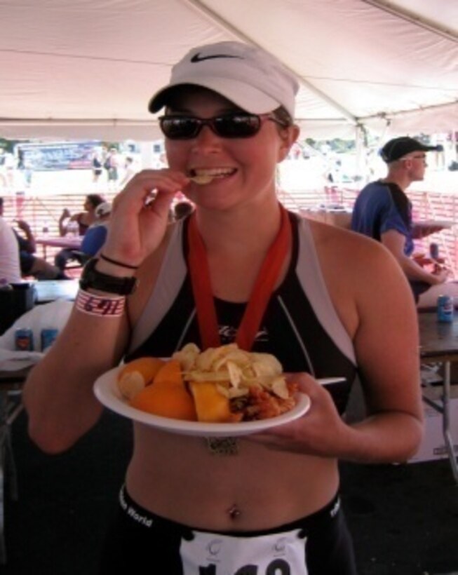 Amy Ward, 27th Special Operations Force Support Squadron personal trainer contractor, refuels post-race after a hot day at the 2006 Spirit of Racine Half Ironman in Racine, Wis. Ward is currently serving Cannon Air Force Base, N.M., and the Clovis, N.M., area. (Courtesy photo)