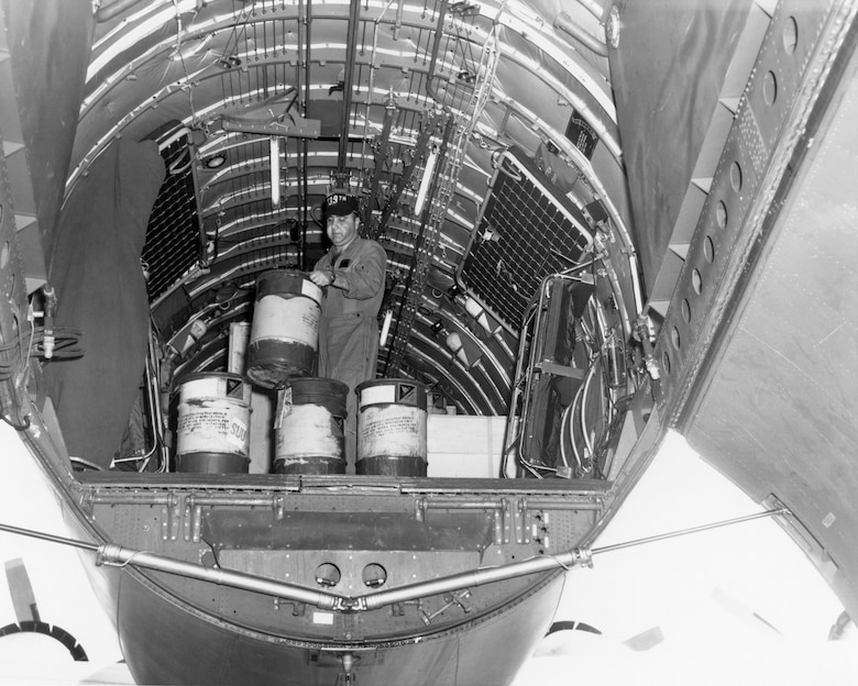 Tech. Sgt. Michael A. Messineo, New York ANG C-97 loadmaster, helps unload his aircraft at Tan Son Nhut Air Base, South Vietnam, in 1966. (U.S. Air Force photo)