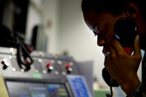 The command post serves as the central nervous system for coordinating everything from first responders to recalls. The Airmen assigned to the 5th Bomb Wing command post are responsible for notifying emergency responders, base personnel about alarm conditions and weather, and keeping the commander informed about significant events on base. (U.S. Air Force photo/Senior Airman Brittany Y. Auld)