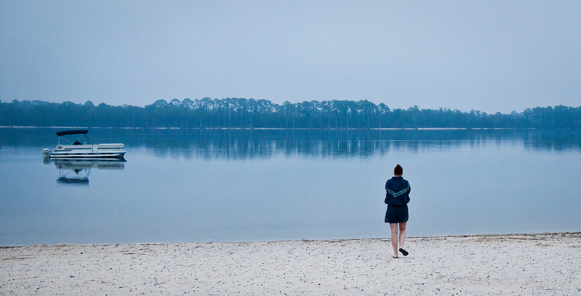 An Airman makes her way out to dip her toe into the chilly waters of Choctawhatchee Bay prior to Eglin’s annual Polar Bear Plunge, held at Post’l Point, Jan. 10.  Only a few brave swimmers lasted longer than five minutes in the 55 degree water.  (U.S. Air Force photo/Samuel King Jr.)