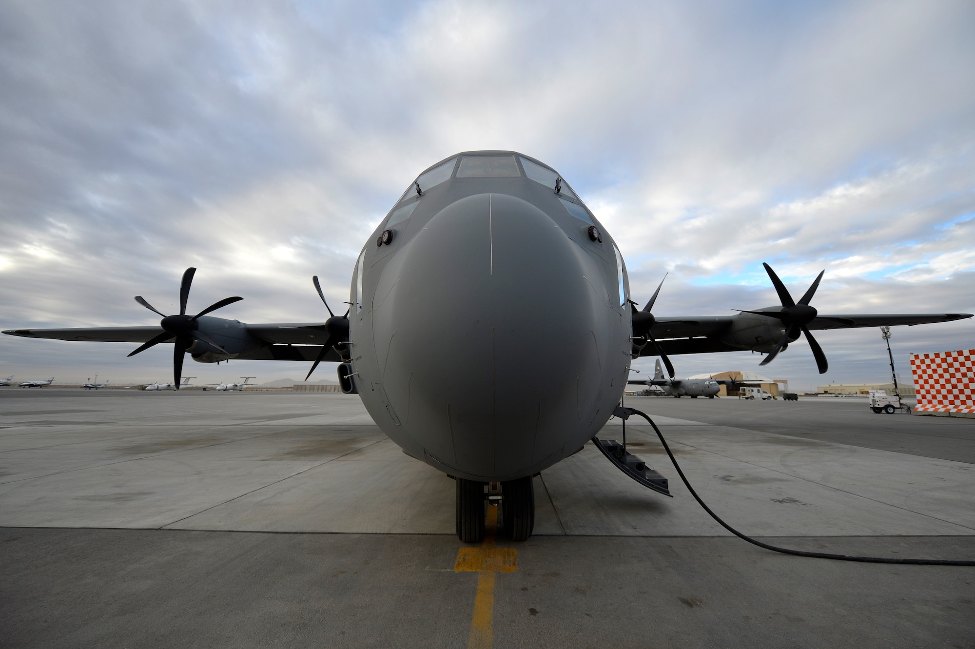 A C-130J Super Hercules sits on the flight line awaiting departure at Kandahar Airfield, Afghanistan, Jan. 12, 2013. The C-130J Super Hercules will take over for the C-130 Hercules at Bagram Airfield, after four months at Kandahar. (U.S. Air Force photo by Senior Airman Kayla Newman/Released)