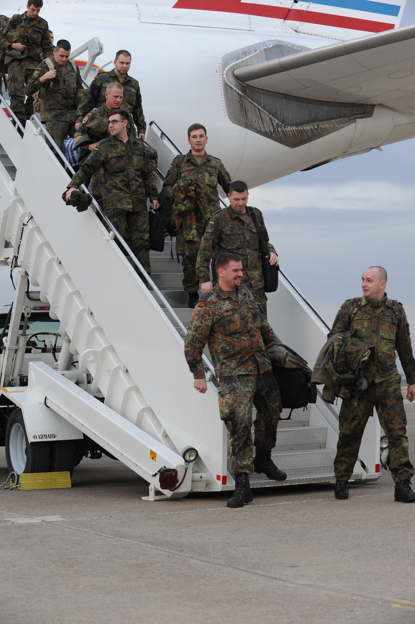 German soldiers disembark from a French air force Airbus A310 that arrived Jan. 9, 2014, at Incirlik Air Base, Turkey. The German government recently approved a year-long extension for German support of the ongoing NATO mission to increase Turkey’s air defense capabilities against Syrian ballistic missile threats. The arriving personnel will relieve deployed soldiers currently manning two Patriot missile batteries in Kahramanmaras, Turkey. (U.S. Air Force photo by 1st Lt. David Liapis/Released)