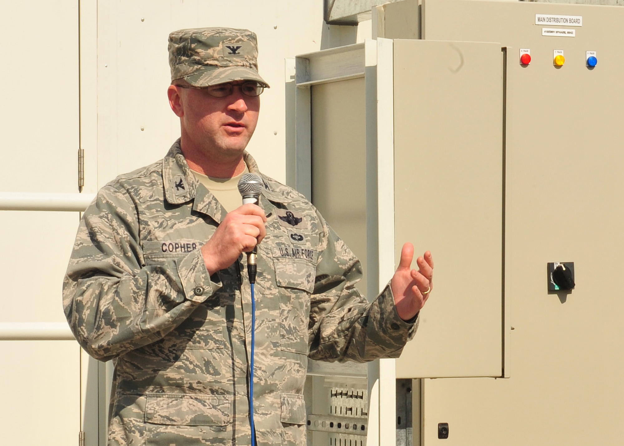Col. James Copher, 380th Air Expeditionary Wing vice commander, speaks to members of the 380 AEW team during the celebration of the medical clinic expansion at an undisclosed location in Southwest Asia, Dec. 29, 2013. The construction of the facility began in February 2013. (U.S. Air Force photo by Tech. Sgt. Colleen Urban/Released) 