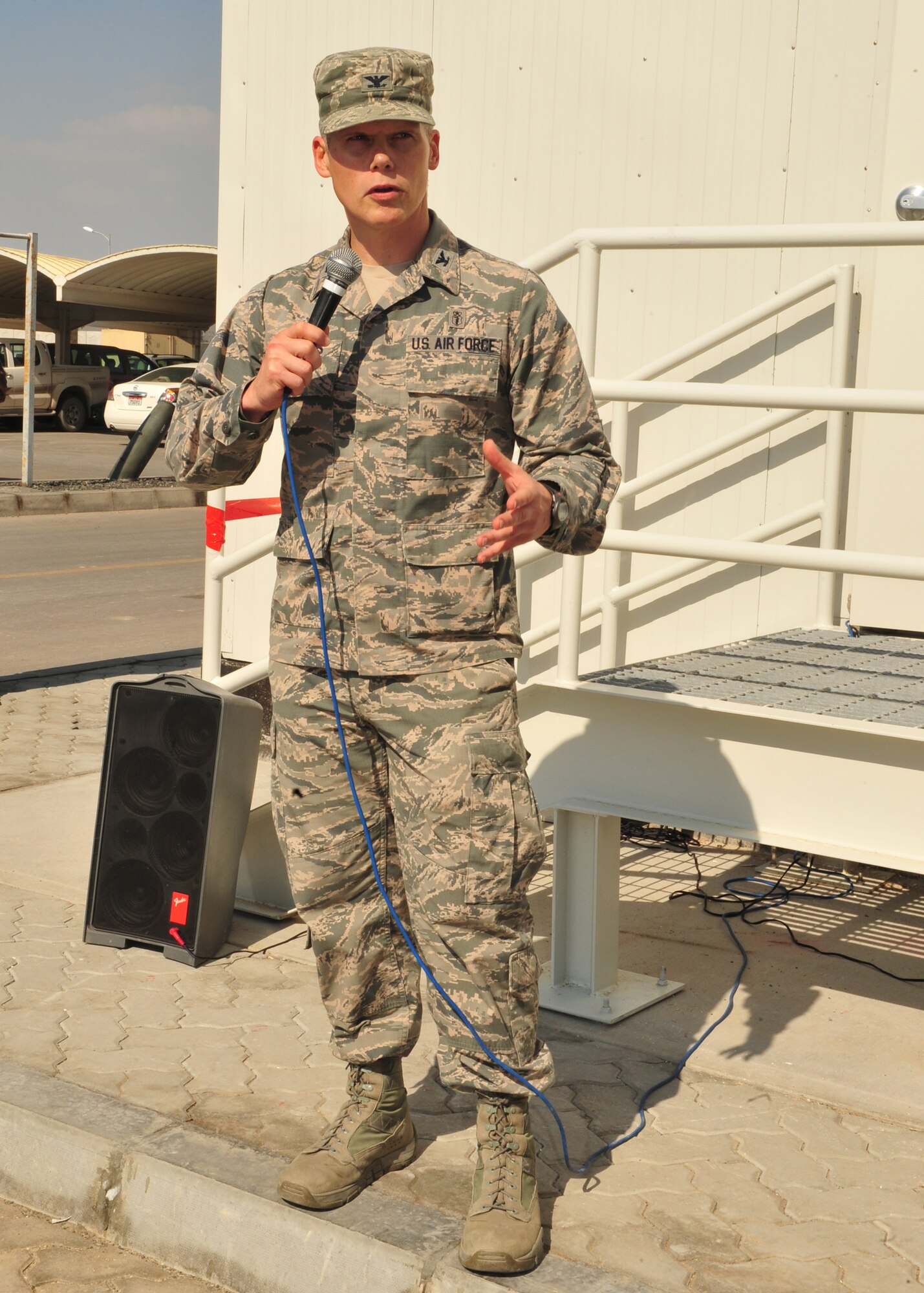 Col. Andrew Meadows, 380th Expeditionary Medical Group commander, speaks to members of the 380 AEW team during the celebration of the medical clinic expansion at an undisclosed location in Southwest Asia, Dec. 29, 2013. The construction of the facility began in February 2013. (U.S. Air Force photo by Tech. Sgt. Colleen Urban/Released) 