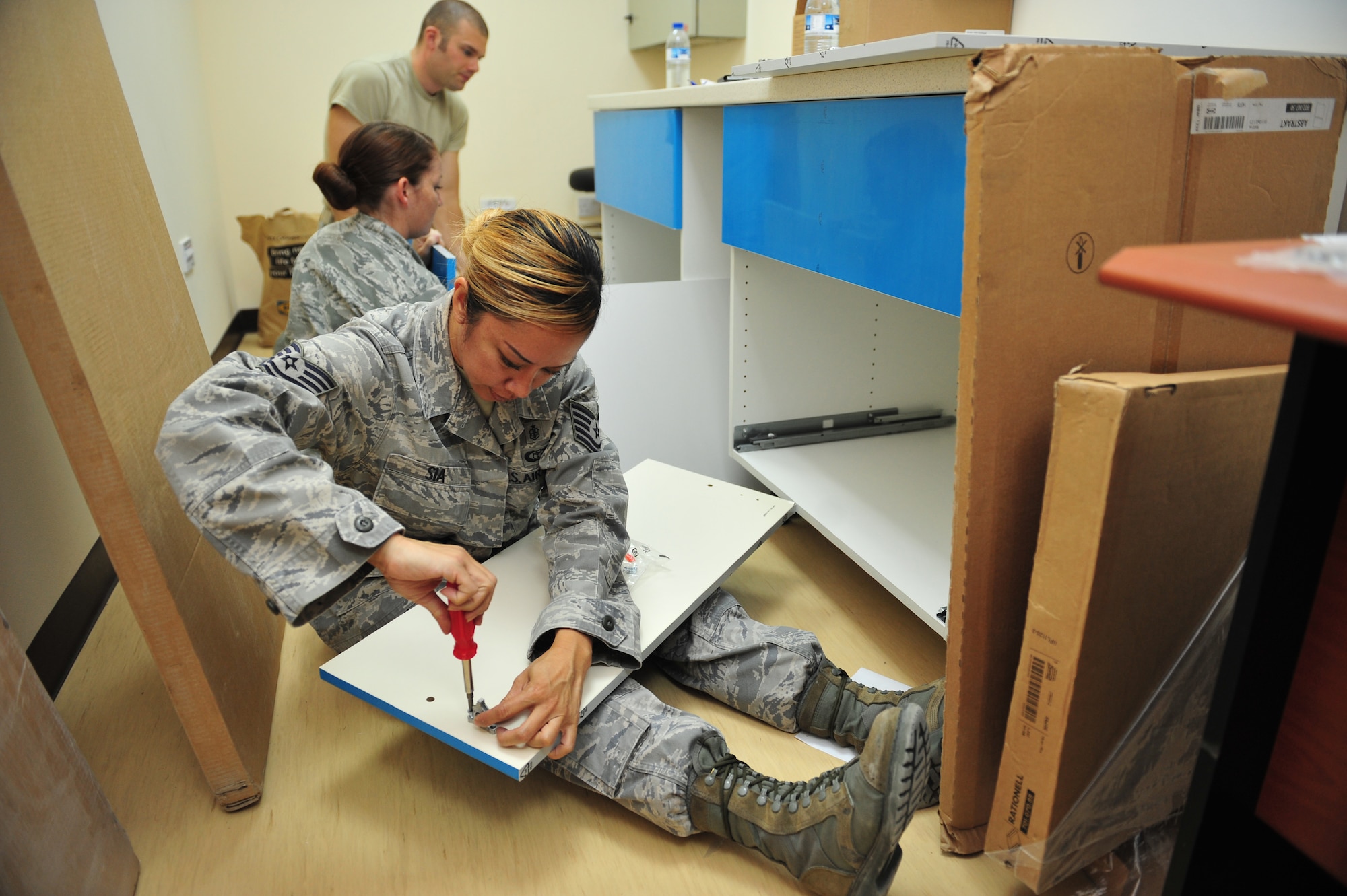 Tech. Sgt. Flordeliza Sia, 380th Medical Group NCO in charge of clinical and pharmacy services, helps set-up the new labratory in the clinic at an undisclosed location in Southwest Asia, Dec. 29, 2013. The lab is scheduled to be available June of this year. (U.S. Air Force photo by Staff Sgt. Michael Means/Released)
