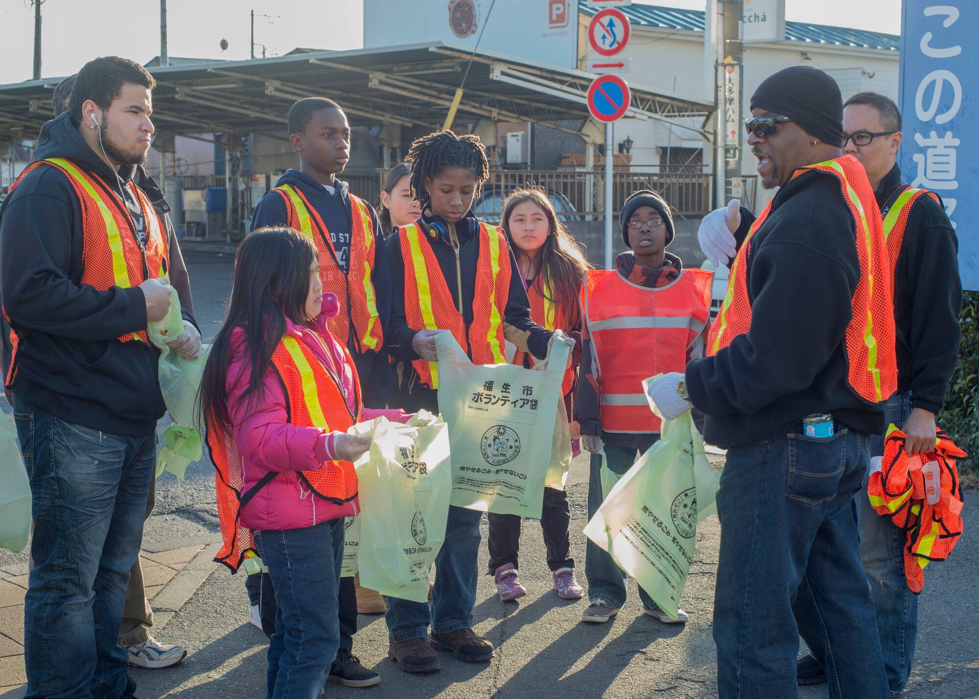 Jay Reynolds, a volunteer worker from Yokota Air Base, Japan, assigns each volunteer group to a different type of trash to pick up in Fussa City, Japan, Jan. 11, 2014.  The cleanup was accomplished in order to honor the Martin Luther King Jr. Day.  (U.S. Air Force photo by Airman 1st Class Soo C. Kim / Released)