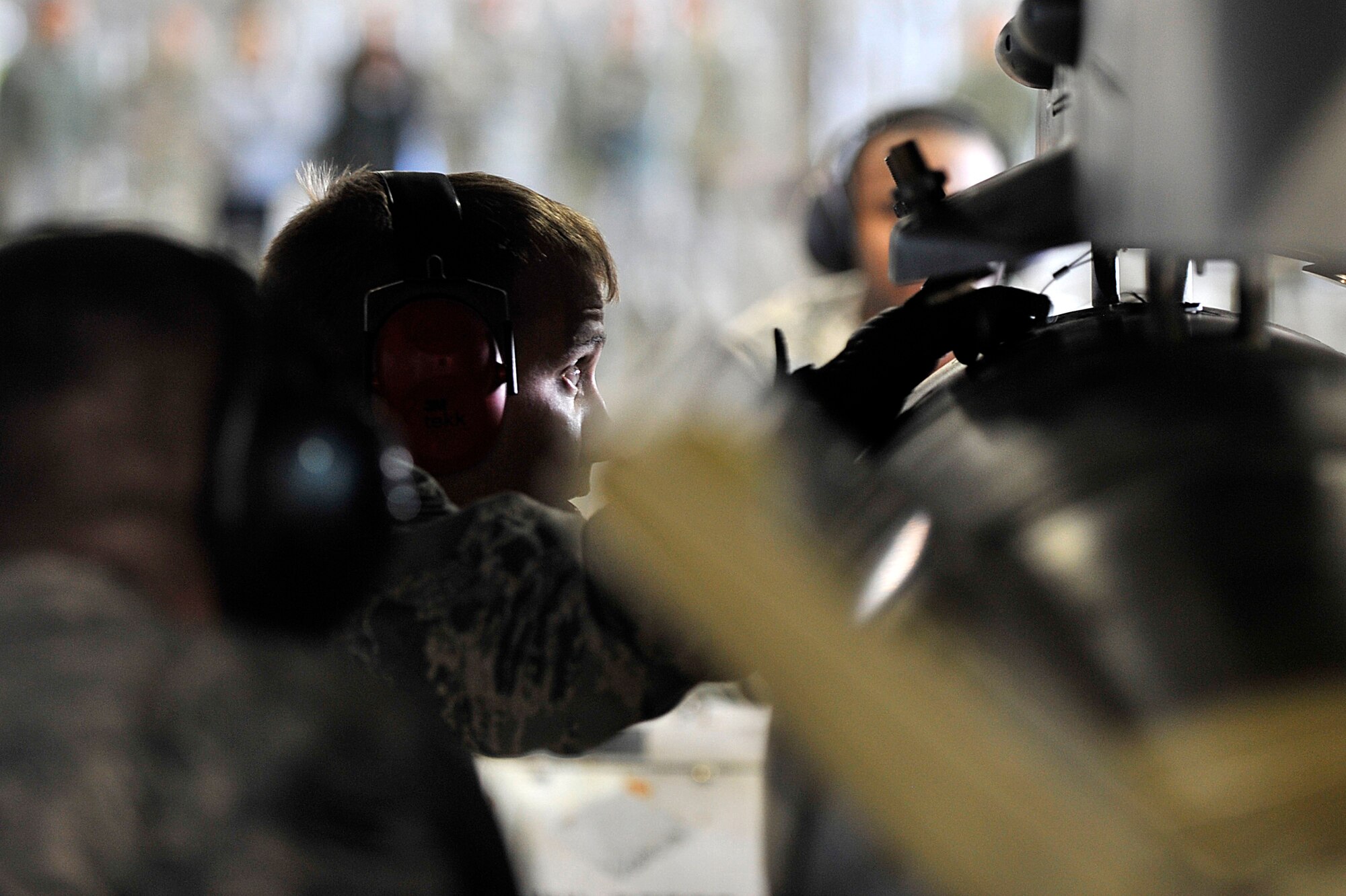 MISAWA AIR BASE, Japan – Staff Sgt. Andrew Waddell, 14th Aircraft Maintenance Unit load crew chief, monitors the distance between a GBU-10 and the weapons rack of an F-16 Fighting Falcon for the 4th Quarter Load Crew Competition at Misawa Air Base, Japan, Jan. 10, 2014. The competition between maintainers from the 13 and 14 AMU serves to prove which load crew performed the best for the fourth quarter, October to December 2013. (U.S. Air Force Photo by Staff Sgt. Tong Duong)