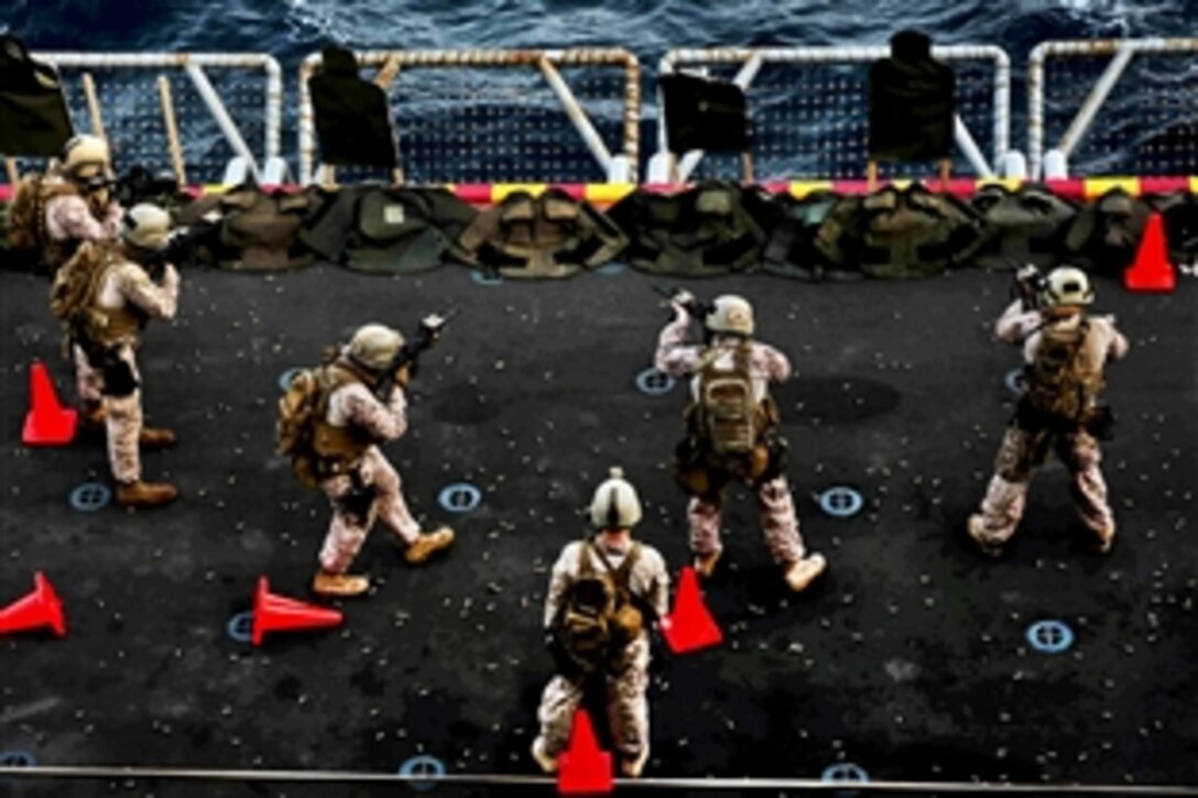 Marines conduct live-fire training aboard the USS Boxer at sea, Jan. 8, 2014. The  The Marines are assigned to Battalion Landing Team, 1st Battalion, 4th Marine Regiment, 13th Marine Expeditionary Unit, which serves as a theater reserve and crisis response force throughout the U.S. 5th Fleet area of responsibility. 