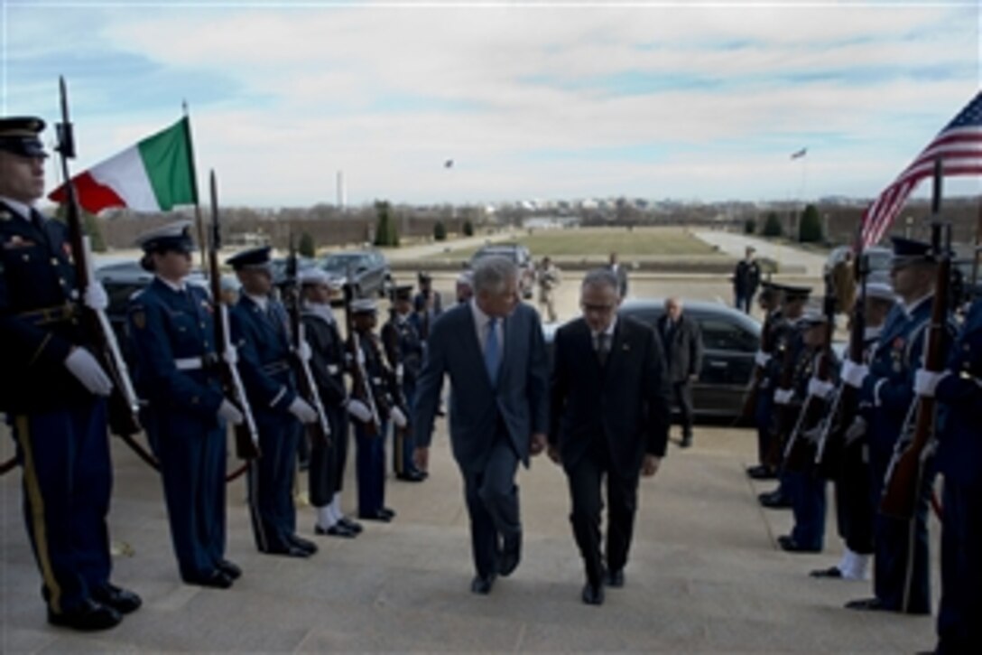 U.S. Defense Secretary Chuck Hagel escorts Italian Defense Minister Mario Mauro through an honor cordon at the Pentagon, Jan. 13, 2014. Hagel and Mauro met to discuss global security and cooperative efforts such as the Joint Strike Fighter program. 
