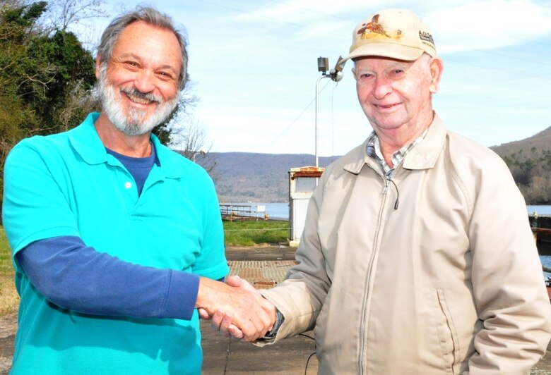 Earl Keeler, 91, (right) retired U.S. Army Corps of Engineers Nashville District lock operator thanks just recently retired Nickajack Lock lockmaster and old friend Butch Witcher for arranging their Dec. 19, 2013 visit to the 100-year-old Hales Bar Lock site where Keeler worked from 1960 until its closing in 1967.  Keeler then transferred to Nickajack Lock where he helped train Witcher in 1980.