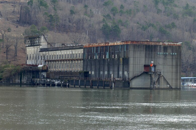 This is the Hales Bar Dam power plant building in Haletown, Tenn., taken from across the Tennessee River at the crumbling navigation lock Dec. 19, 2013 on the bank of the Tennessee River in Jasper, Tenn.  Hales Bar Dam opened in 1913 and the project was the first to provide hydropower in the world. The dam ceased operations in 1968 when Nickajack Dam opened a few miles downstream.  One hundred years later the region looks back and remembers life at Hales Bar Dam and Navigation Lock.
