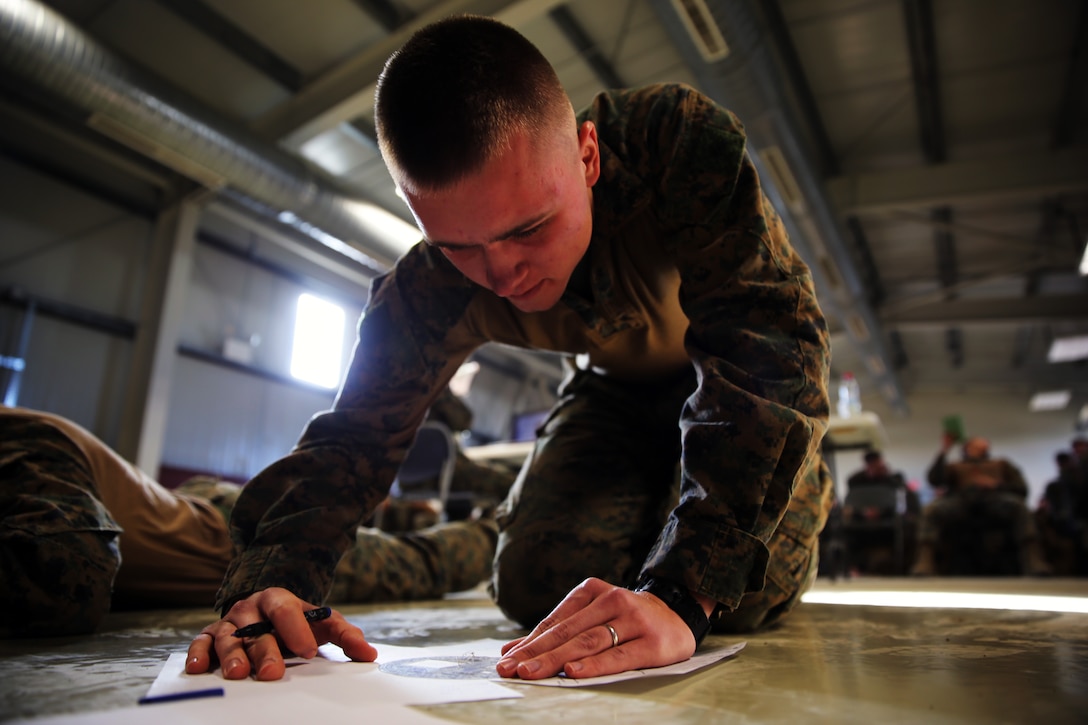 Lance Cpl. Glenn Schroeder, a rifleman with Black Sea Rotational Force 14, and this week’s Marine of the Week, takes a written test during a unit-wide squad competition at Mihail Kogalniceanu, Romania, Jan. 13, 2014. Schroeder has a trend of success by continuing to demonstrate dedication to all tasks, diligence, selflessness, flexibility and outstanding self-discipline.

