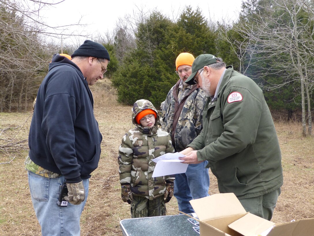 Supervisory Biologist, Bruce Caldwell, gives young hunters and their escorts directions to their hunting blind.   