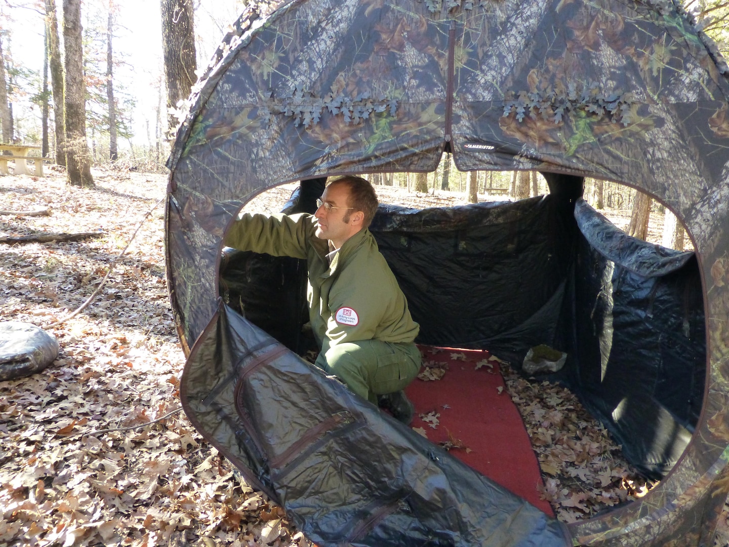 Natural Resources Specialist, Ty Fowler, setting up blinds for the Ozark Isle Youth Deer Hunt.