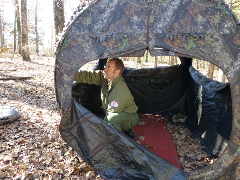 Natural Resources Specialist, Ty Fowler, setting up blinds for the Ozark Isle Youth Deer Hunt.