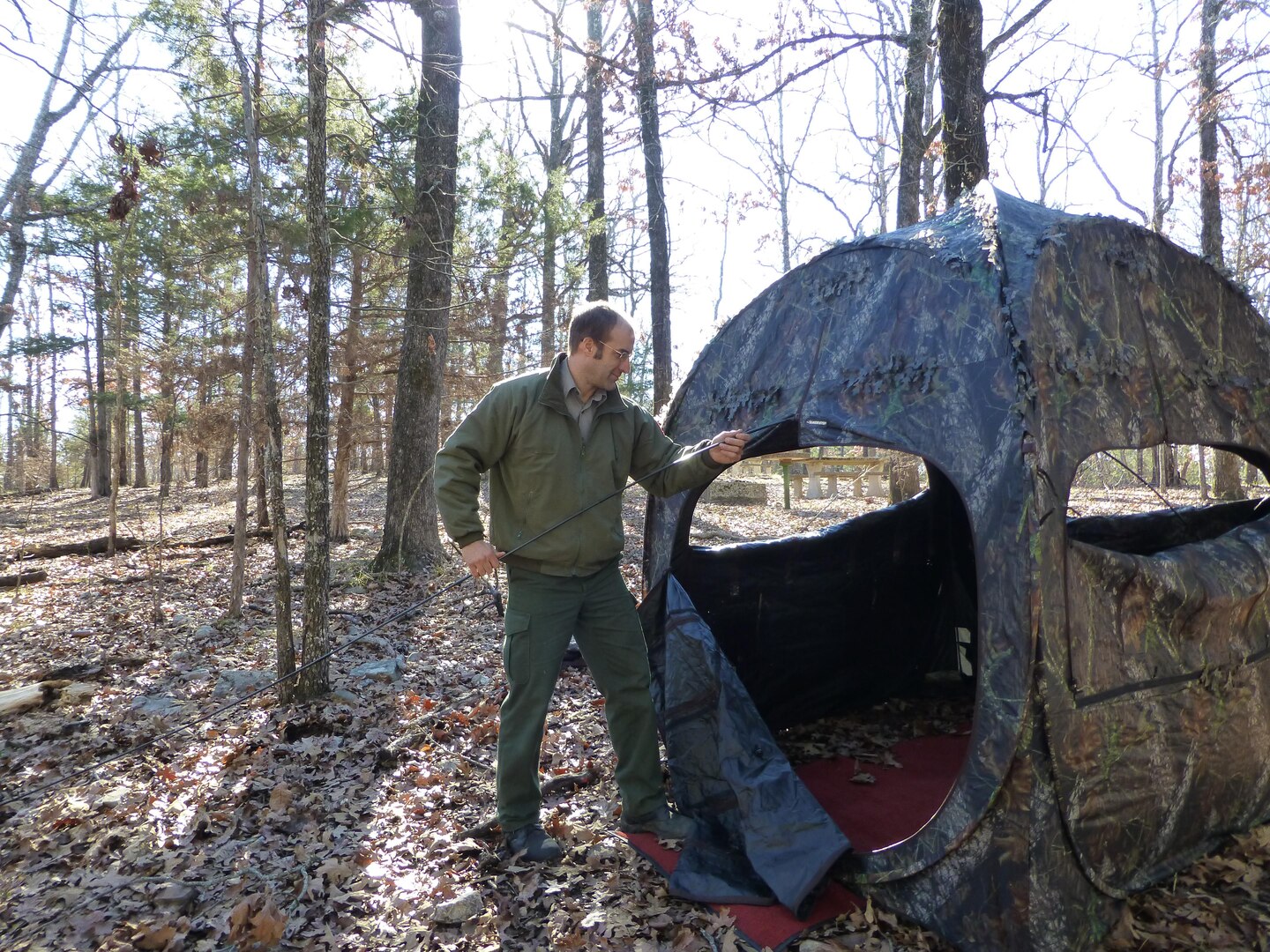 Natural Resources Specialist, Ty Fowler, setting up blinds for the Ozark Isle Youth Deer Hunt.