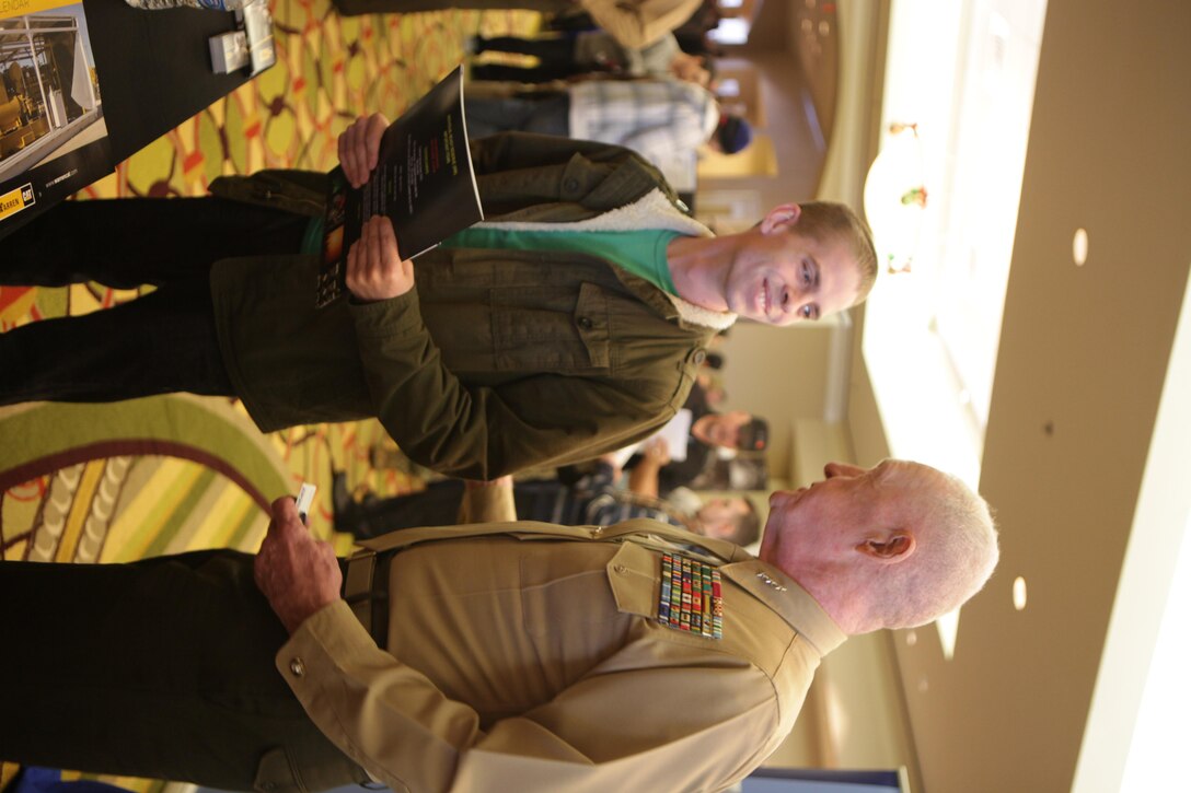 Lt. Gen. Richard P. Mills, the commander of Marine Forces Reserve and Marine Forces North, talks with James Crist about his employment search during the annual IRR Mega-Muster in Fort Worth, Texas, Jan. 11, 2014. The annual mega-muster is sponsored by the Marine Corps Individual Reserve Support Activity, Marine Forces Reserve. The muster gives IRR Marines an opportunity to update personal information, get information on education and job opportunites, and go through medical screening. (Official photo by Lance Cpl. Brytani Musick) 


