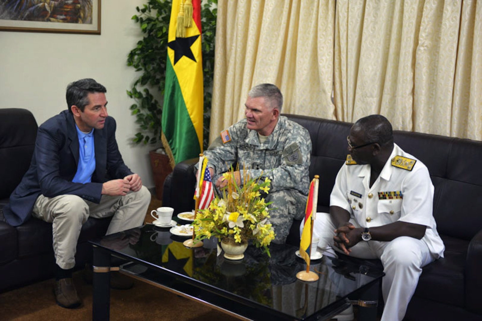North Dakota Lt. Gov. Drew Wrigley and Maj. Gen. David Sprynczynatyk, adjutant general for the North Dakota National Guard, meet with Adm. Mathew Quashie, Chief of the Defence Staff, Ghana Armed Forces, at Burma Camp, Accra, Ghana on Jan. 8, 2014.