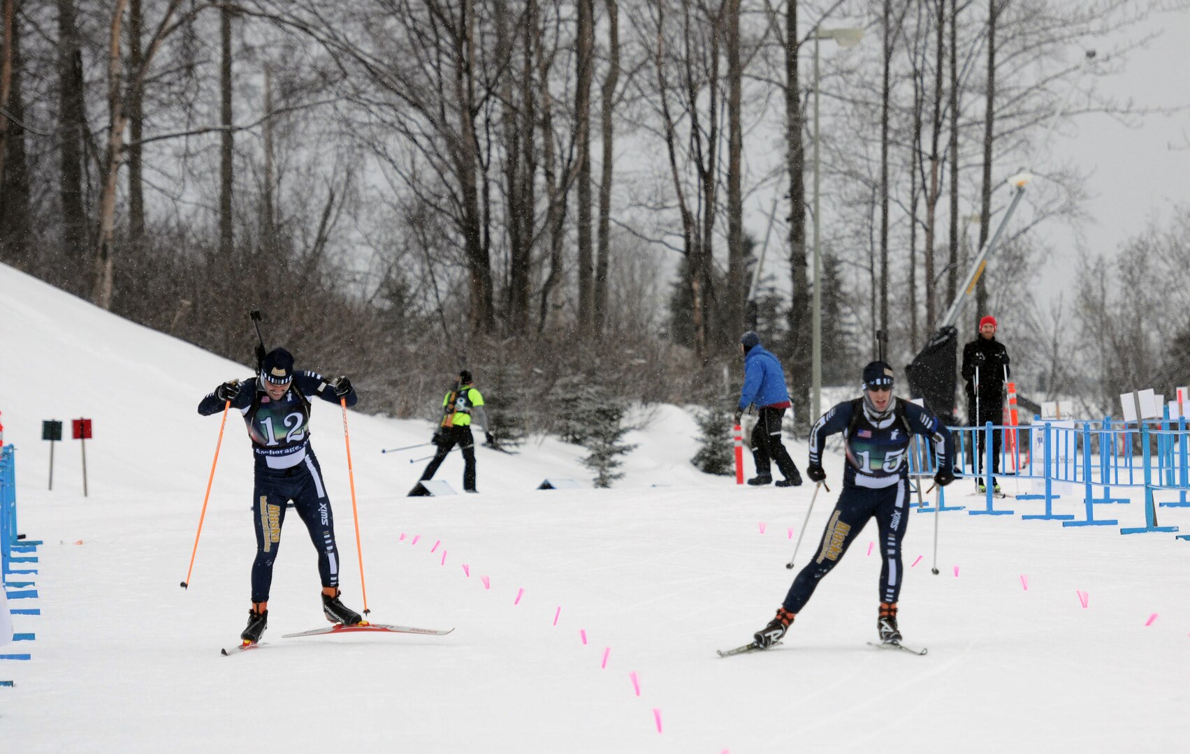Spc. Jake Todd, left, Alaska Army National Guard and Staff Sgt. Jamie Haines, right, Alaska Air National Guard, sprint to the finish line during the pursuit competition of the National Guard Bureau's Western Regional Biathlon at Kincaid Park in Anchorage, Alaska, Jan. 12, 2014.