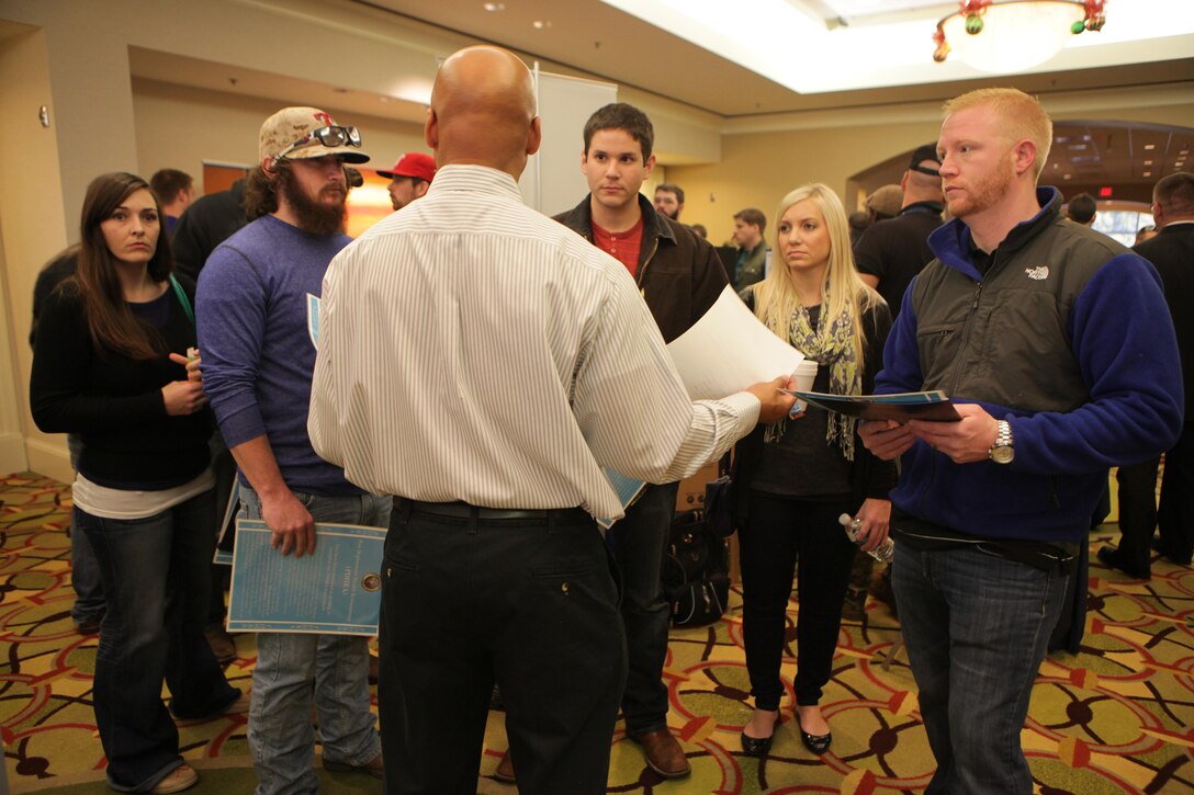 Gerard Lee, the medical office manager of Marine Corps Individual Reserve Support Activity, Marine Forces Reserve, talks with Individual Ready Reserve Marines about their medical screening during the annual IRR Mega-Muster in Fort Worth, Texas, Jan. 11, 2014. MCIRSA conducts medical screening to ensure Marines’ physical and mental well-being. The annual mega-muster is sponsored by MCIRSA, MARFORRES. The muster also gives IRR Marines an opportunity to update personal information, get information on education and job opportunites. (Official photo by Lance Cpl. Brytani Musick)